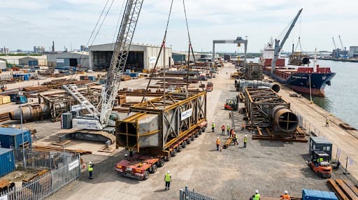Industrial fabrication yard with welded steel modules ready for transport